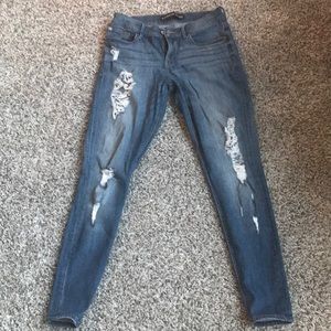 Mid Rise Medium Wash Ripped Ankle Legging Jeans